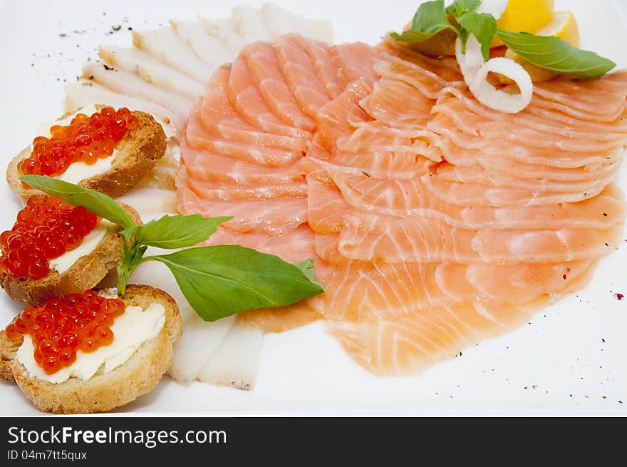 Cutting of the fish on the table in a restaurant. Cutting of the fish on the table in a restaurant