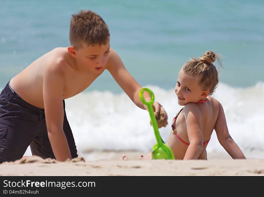 Children playing on the beach during