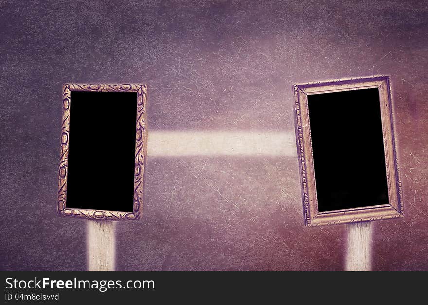 Two Frames Hanging On A Wooden Chair