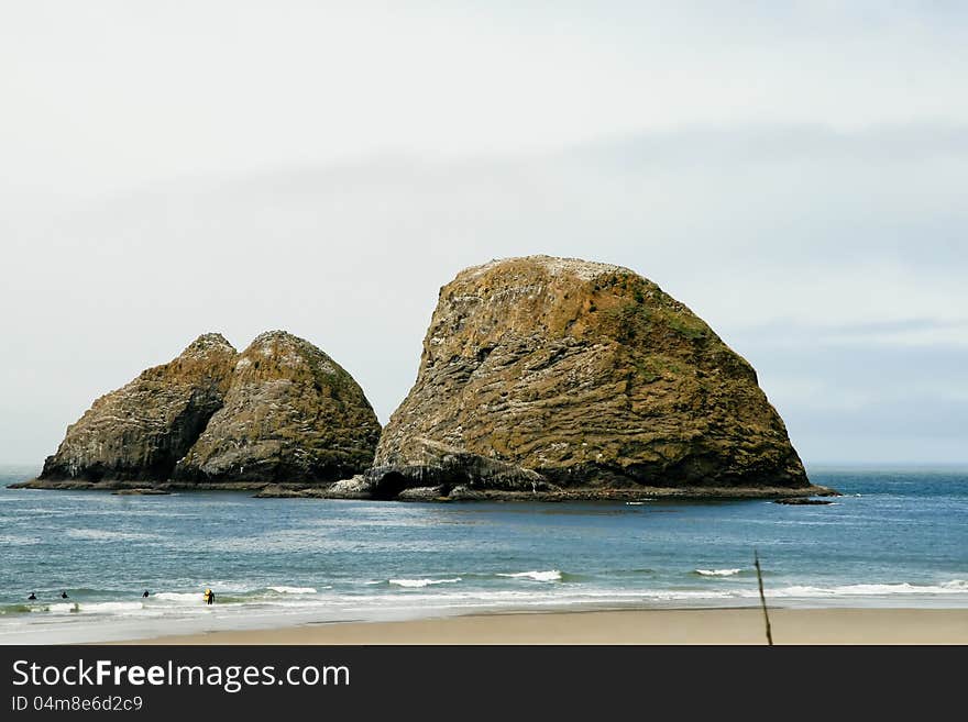 Arch rocks and calm seas provide contrast to the blue of the Pacific. Arch rocks and calm seas provide contrast to the blue of the Pacific.