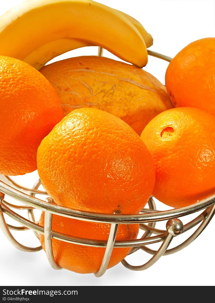 Metal  basket with orange fruits isolated on a white background