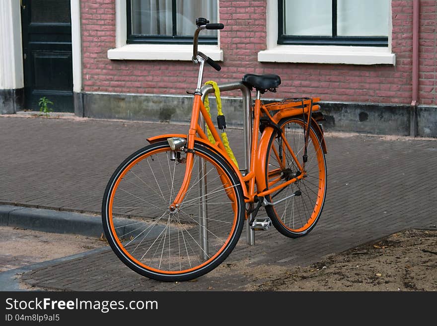 Typical dutch bike in the city of Amsterdam. Typical dutch bike in the city of Amsterdam.