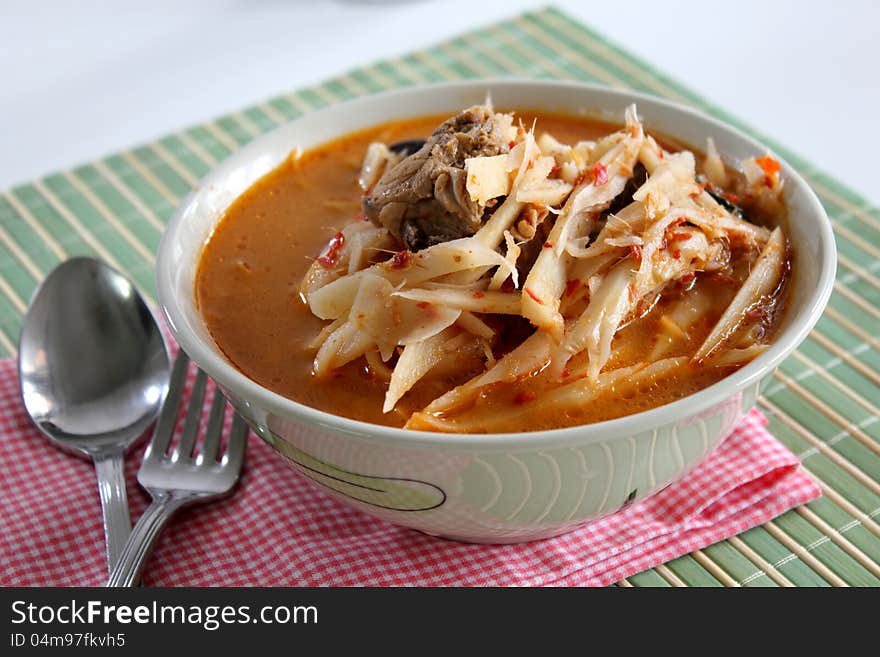 Curry Soft bamboo shoots with spoon fork