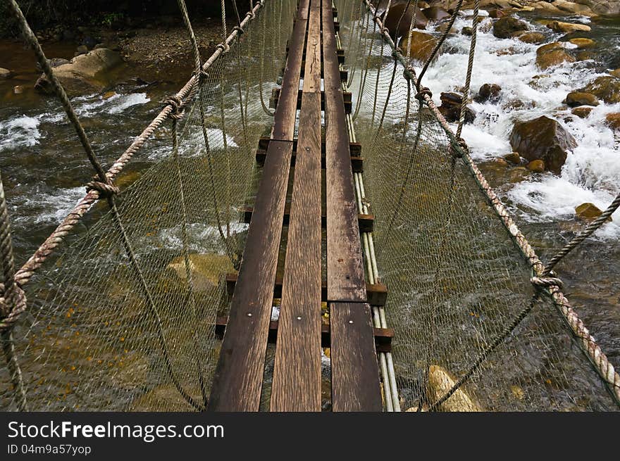 Hanging bridge over waterfall at Chanthaburi province, Thailand.