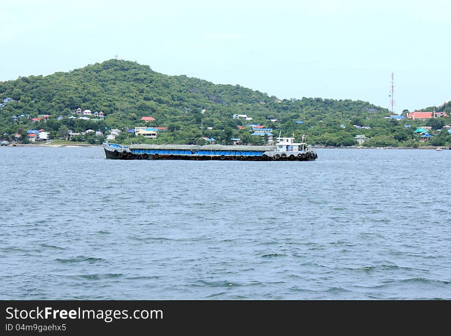 The Cargo ship anchored near the shore