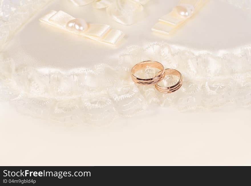 Two golden wedding rings. Wedding background
