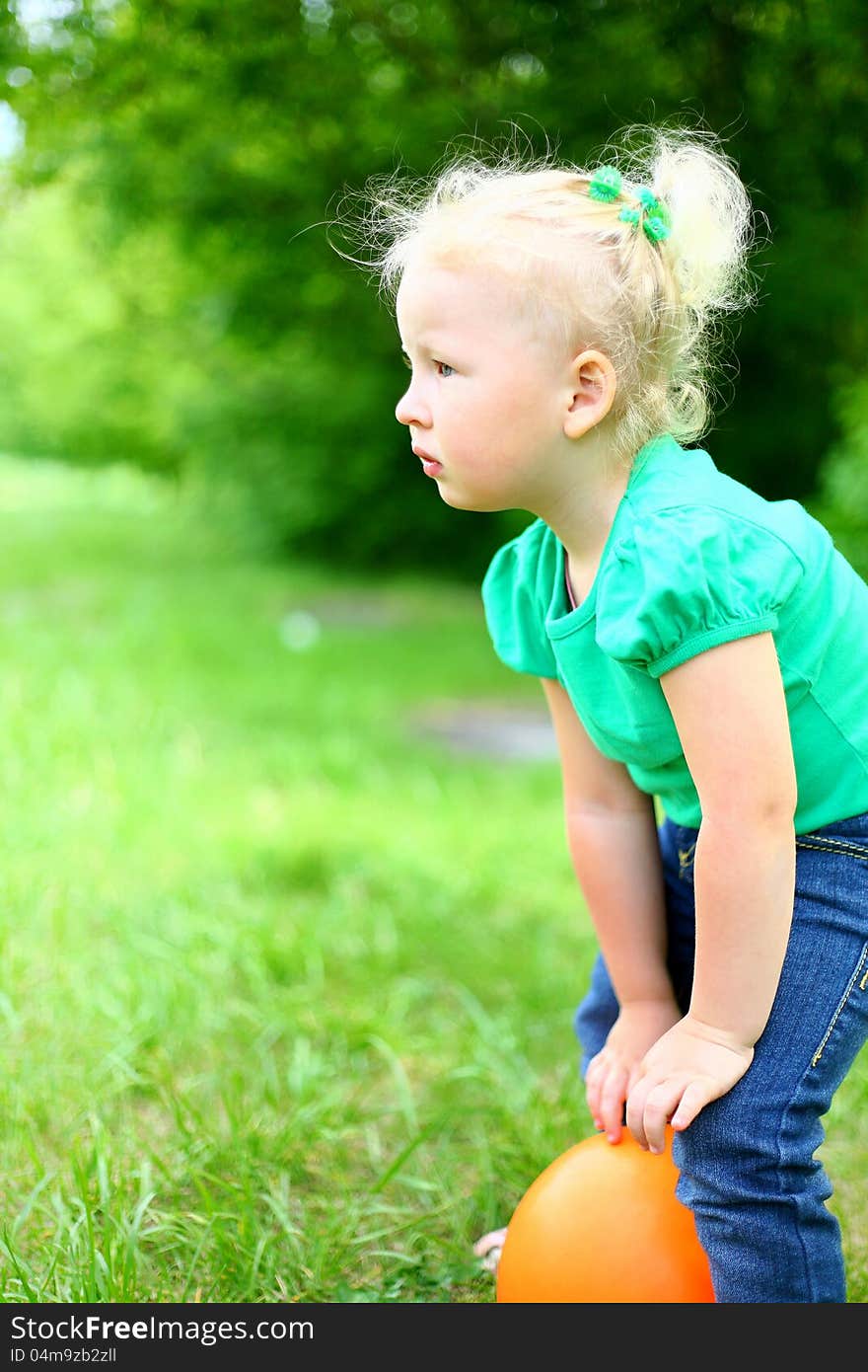 Portrait of a girl with a ball