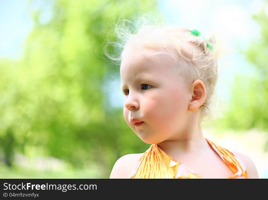 Portrait of a cute child girl in the park