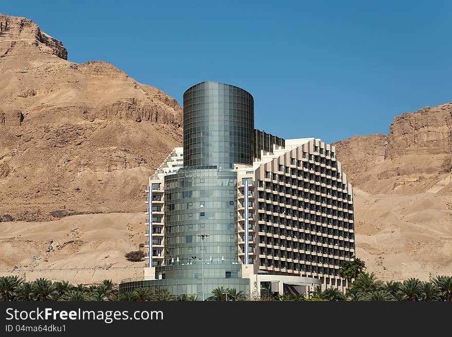 Original building of hotel against rocks and the blue sky