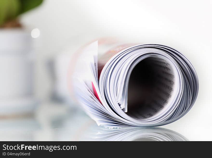 Roll of newspaper on the table