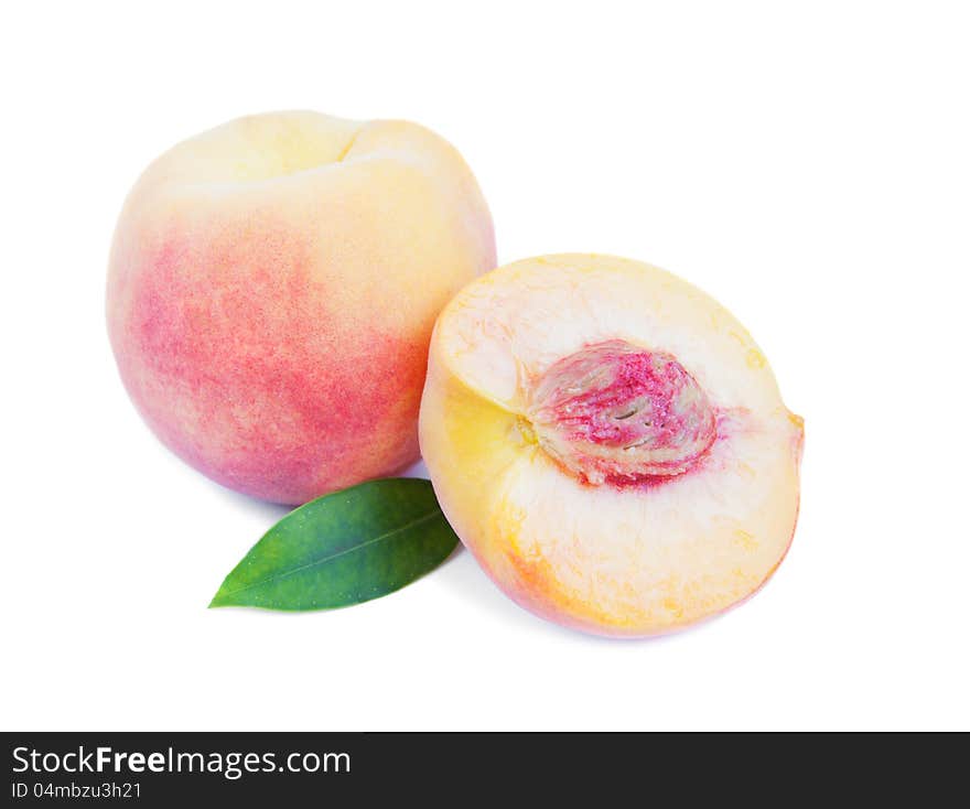 Tasty juicy peaches on a white background