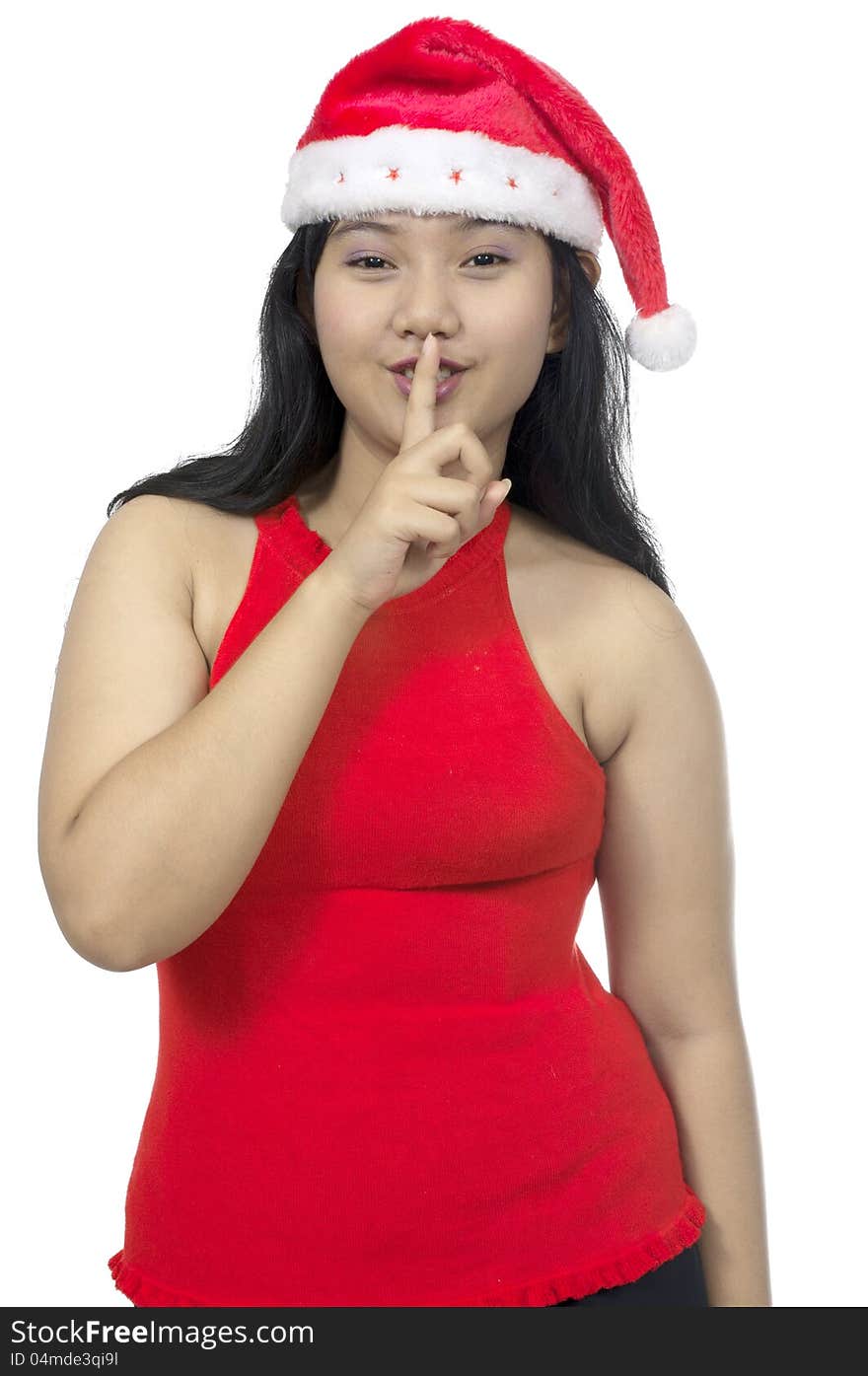 Overweight christmas woman ask you to silence isolated over white background. Overweight christmas woman ask you to silence isolated over white background