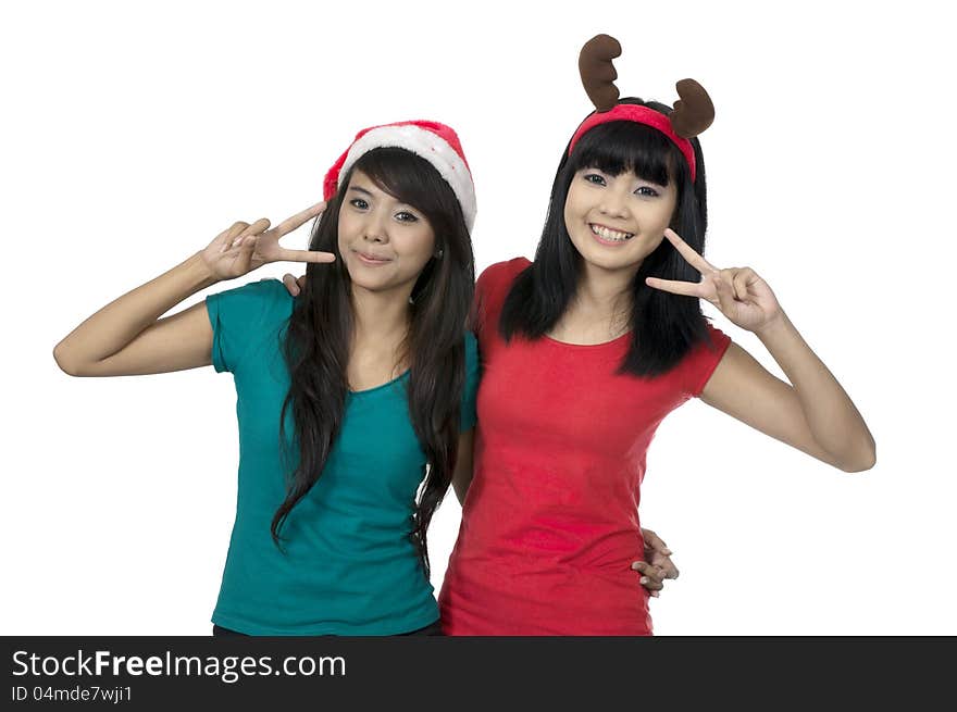 Two girls celebrate christmas isolated over white background. Two girls celebrate christmas isolated over white background