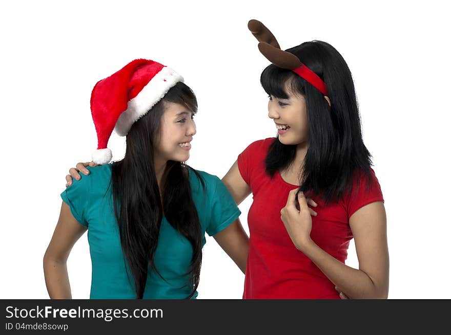 Two girls celebrate christmas isolated over white background. Two girls celebrate christmas isolated over white background