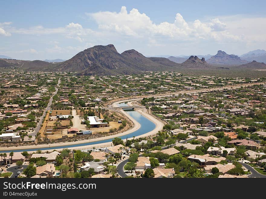 Aerial view of the Arizona Canal winding it's way through a Scottsdale, Arizona suburb