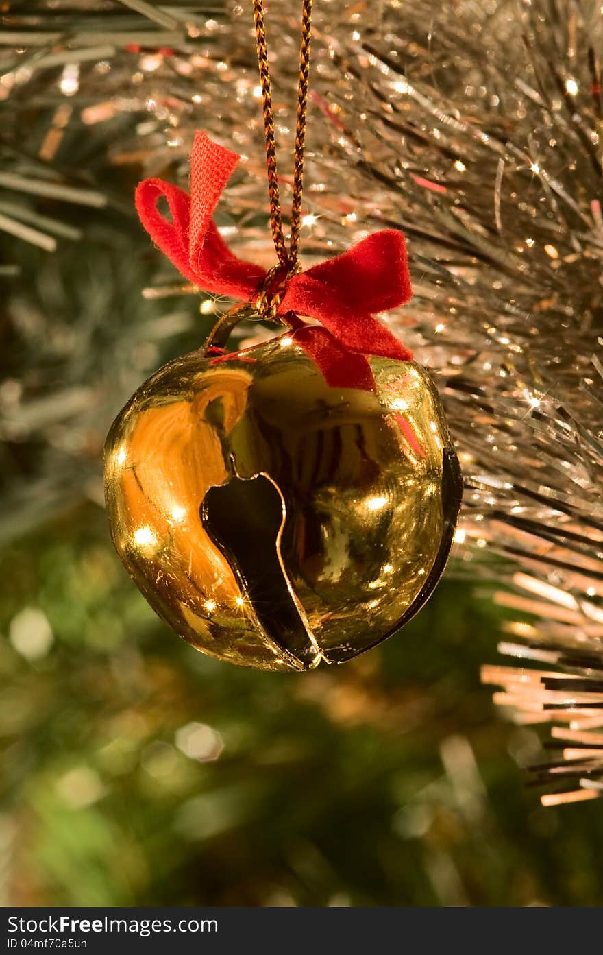 Jingle bells ornament hanging on the Christmas tree. Jingle bells ornament hanging on the Christmas tree