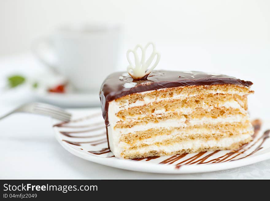 Sweet cake on table with cup of tea. Sweet cake on table with cup of tea