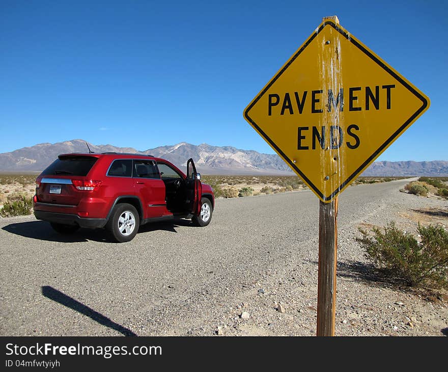 Pavement ends road sign through Death Valley