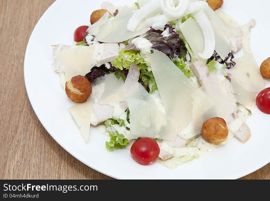 Salad with vegetables, meat and cheese