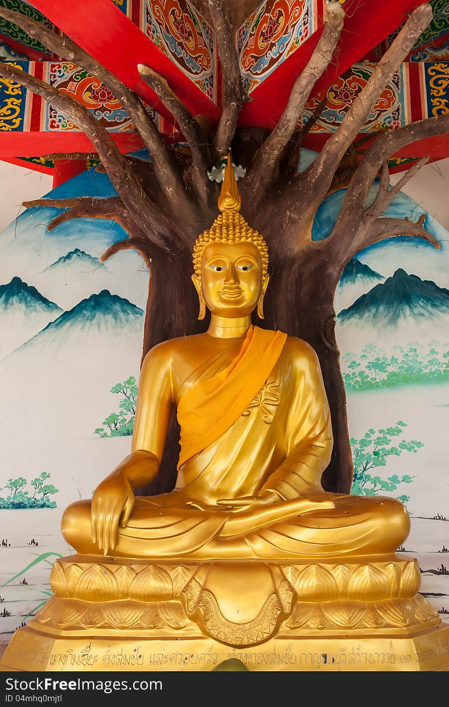 Golden buddha at temple in Kanchanaburi, Thailand