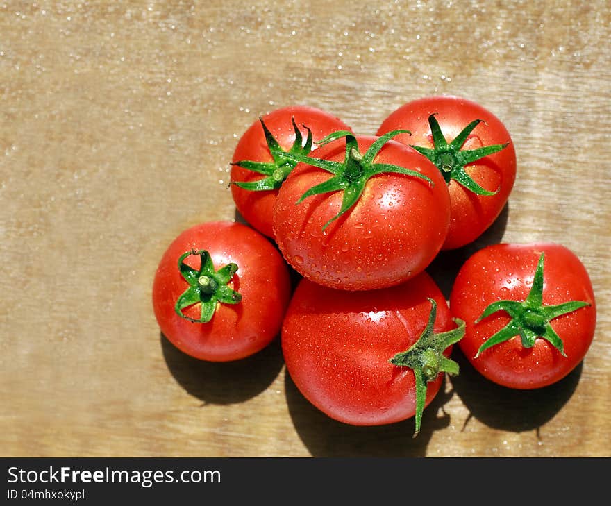 Group Of Natural Tomato With Drops Of Dew