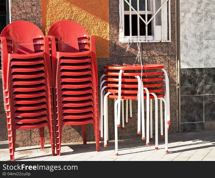 Round tables and plastic chairs by bar of Madrid, Spain. Round tables and plastic chairs by bar of Madrid, Spain