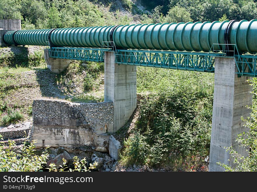 Pipeline crossing a steep valley in the mountains. Pipeline crossing a steep valley in the mountains