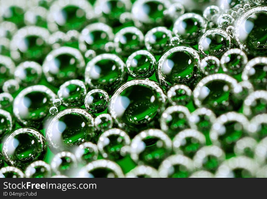 Close up shot of soap foam mixed with green dye. Close up shot of soap foam mixed with green dye