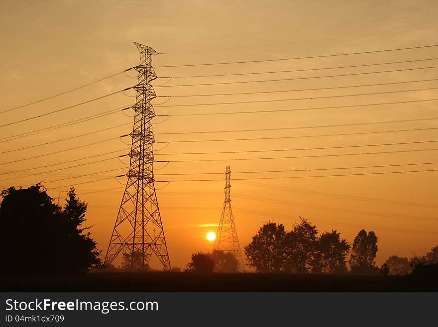 Electric power station on morning background. Electric power station on morning background.