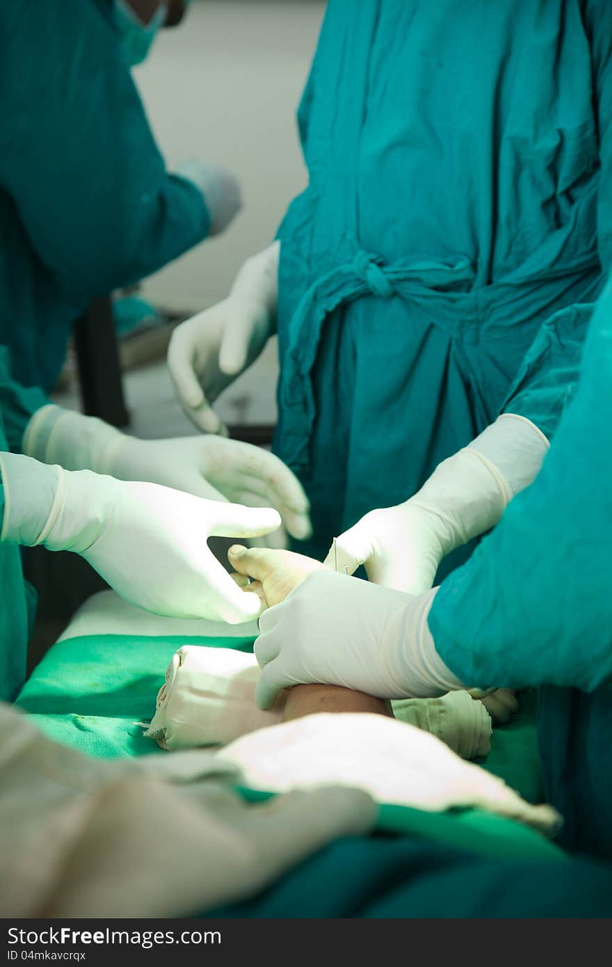 Close up of nurse hands during surgery in operation room. Close up of nurse hands during surgery in operation room