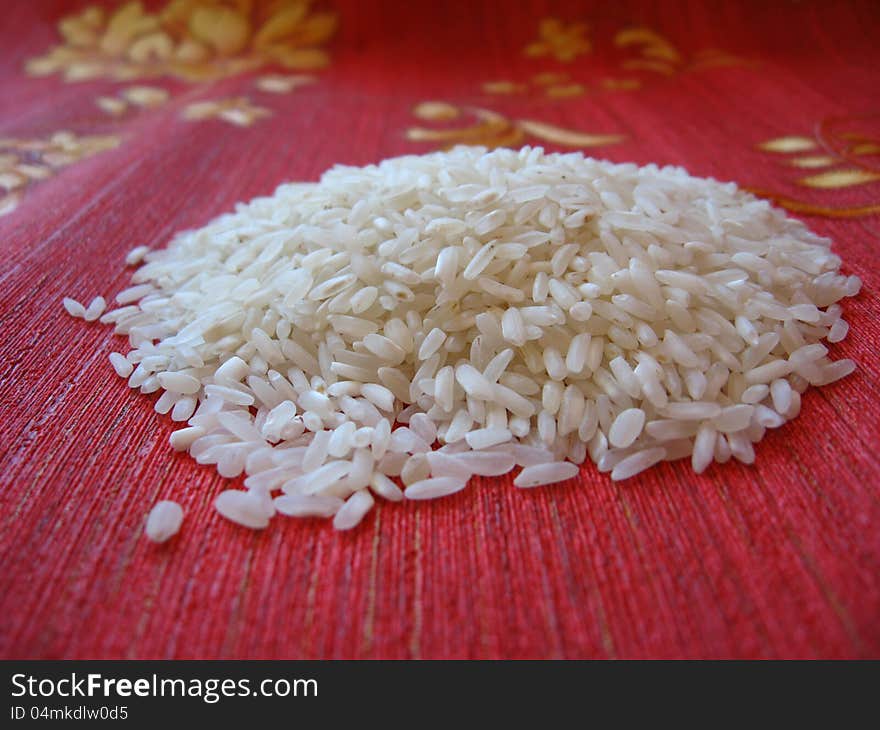 Scattered rice on a red background