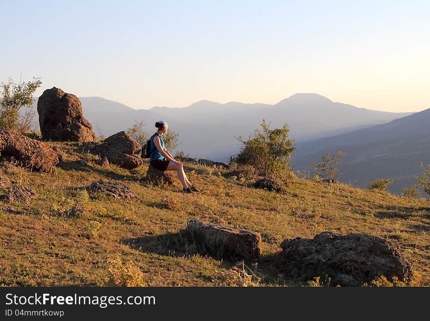 Girl on a rock in the valley