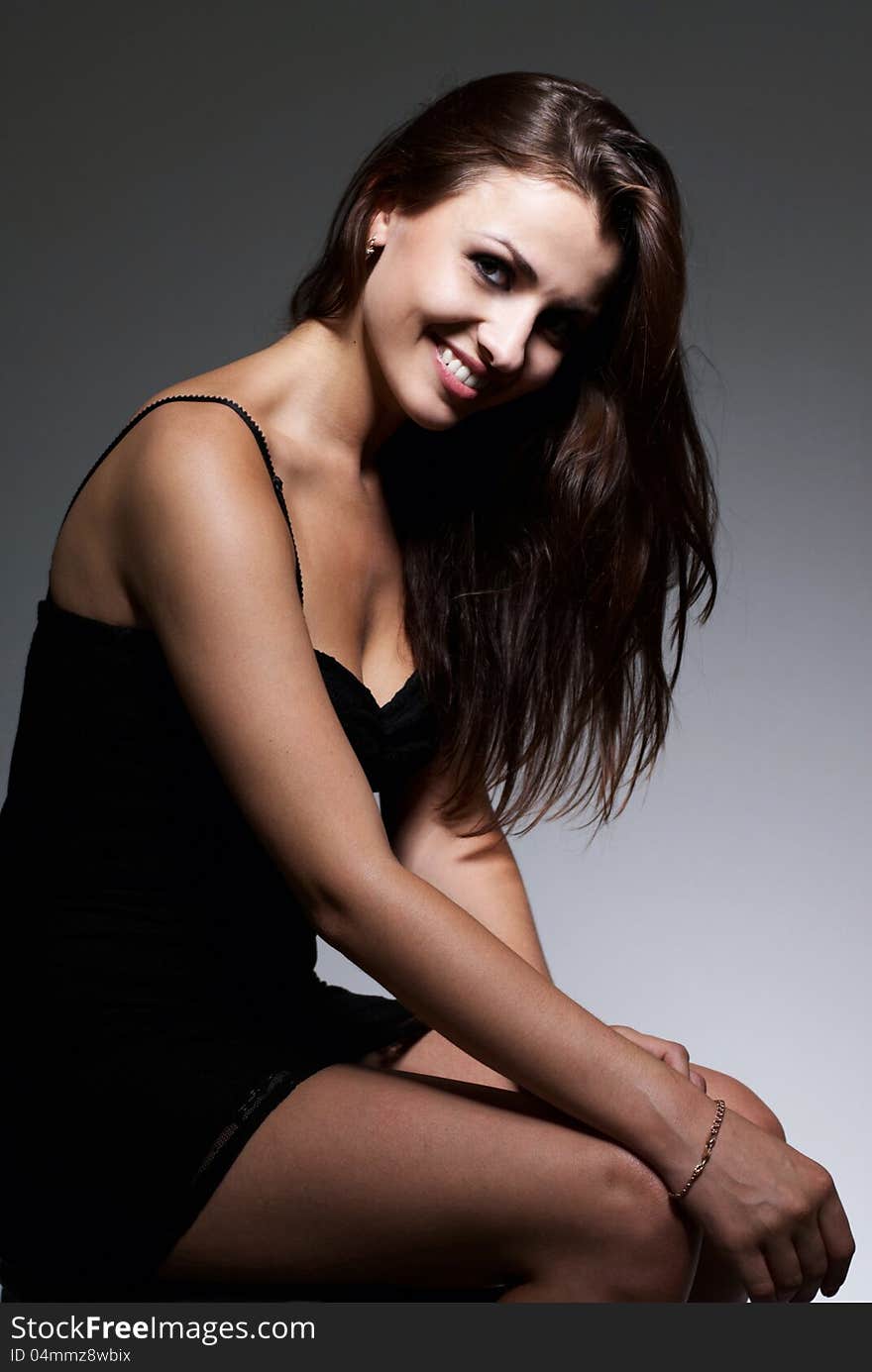 Portrait of young beautiful brunette, studio shot