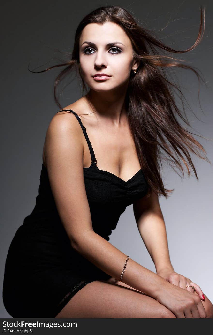 Portrait of young beautiful brunette, studio shot