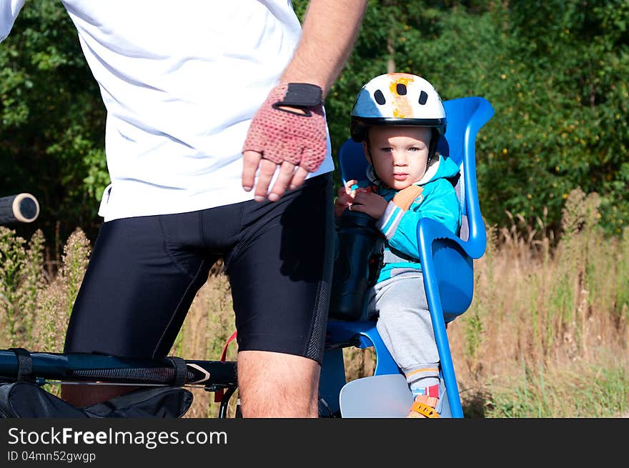 Little boy in bike child seat