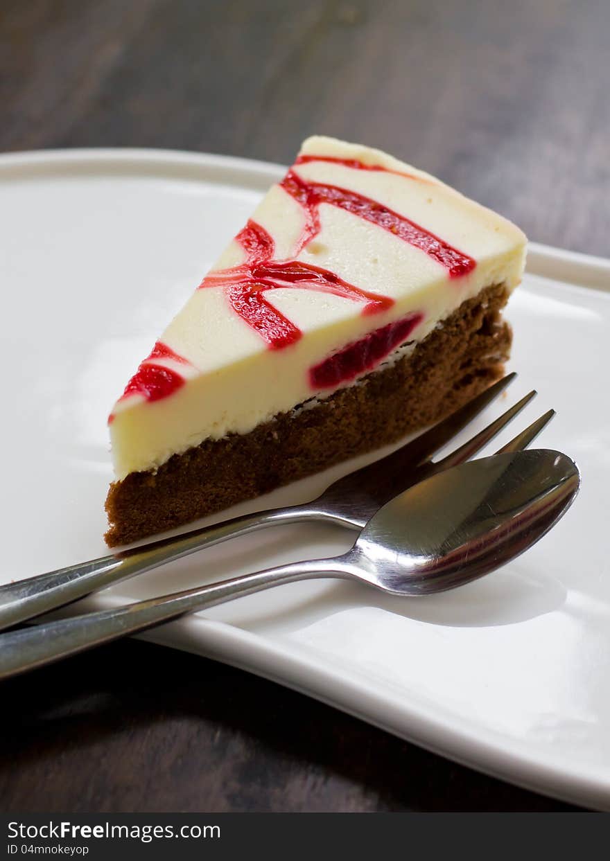 Strawberry cheese cake on wood table