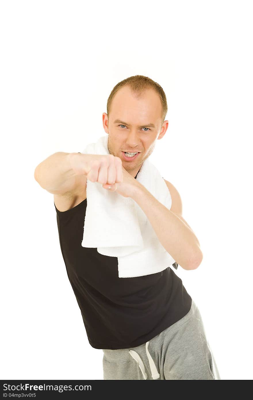 Man in sportswear exercising, with the towel around his neck. Man in sportswear exercising, with the towel around his neck
