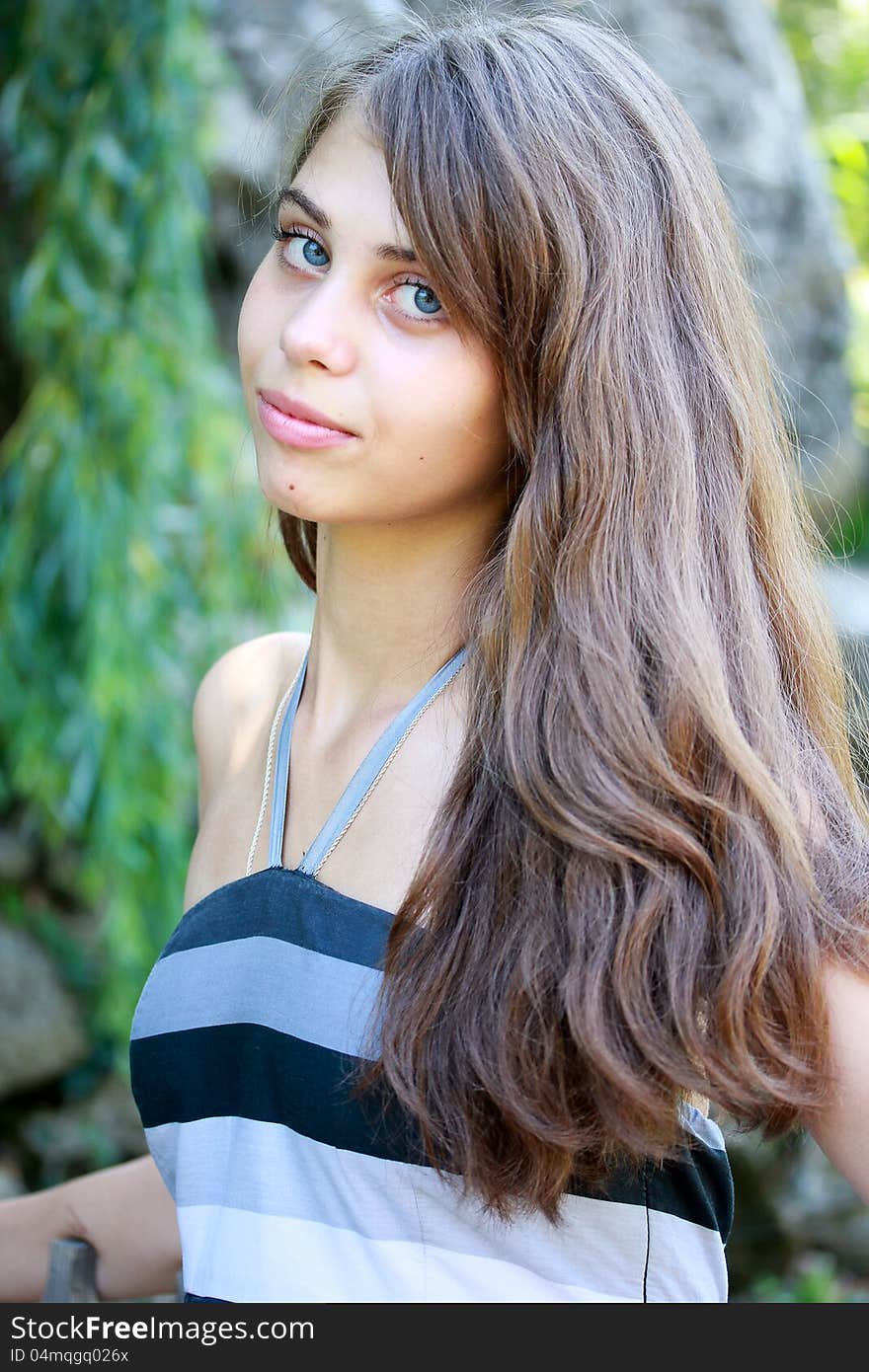 Portrait of beautiful girl with long hair, outdoor