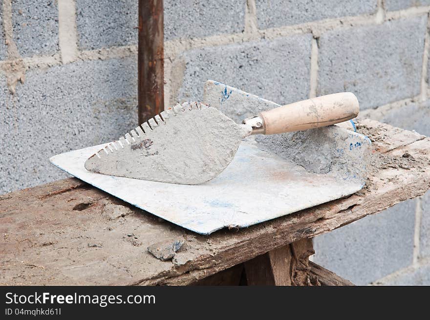 Trowel and plastic construction tools for bricklayer