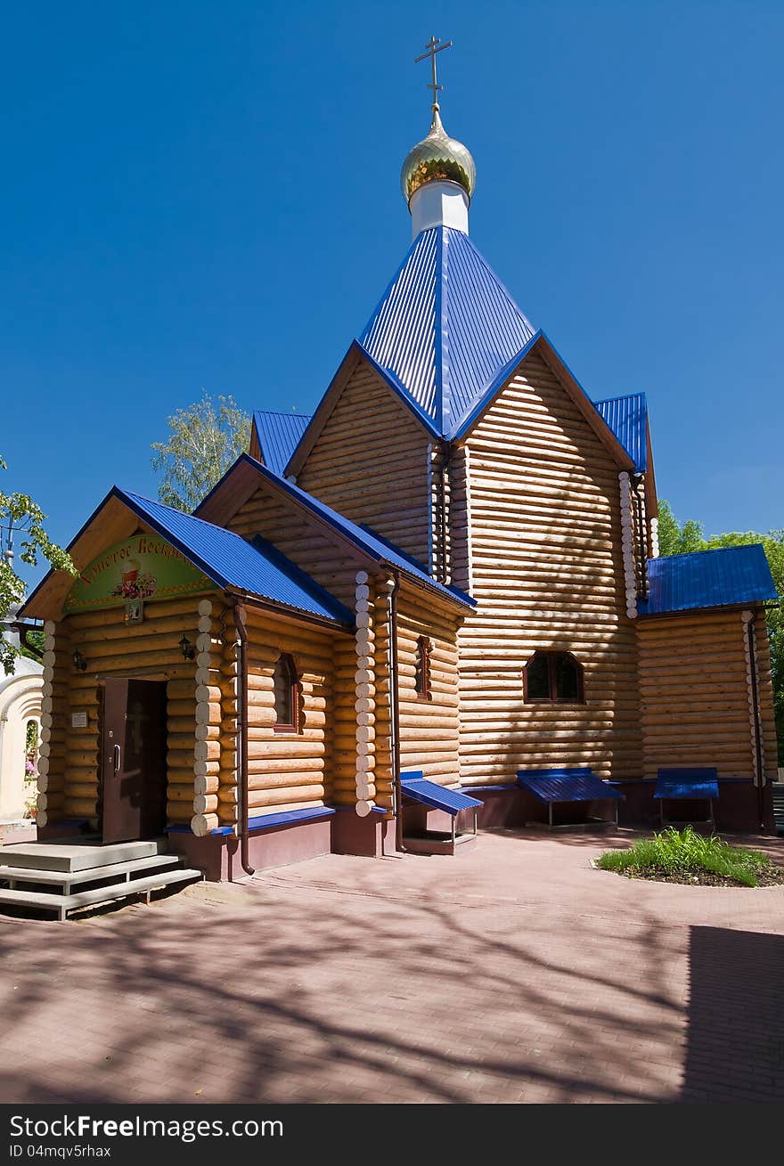 Wooden church and blue sky summer landscape