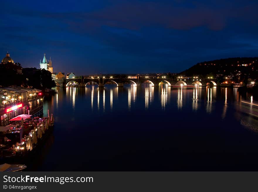 Night look on nabarezhny the Vltava Rivers and Karlov Bridge in Prague. Night look on nabarezhny the Vltava Rivers and Karlov Bridge in Prague