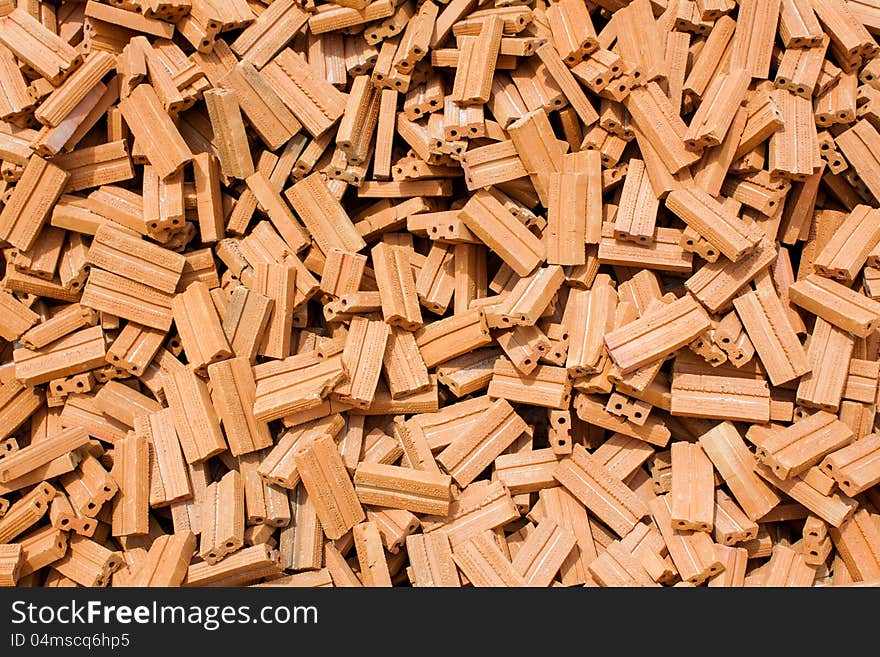 Stack of raw bricks texture background