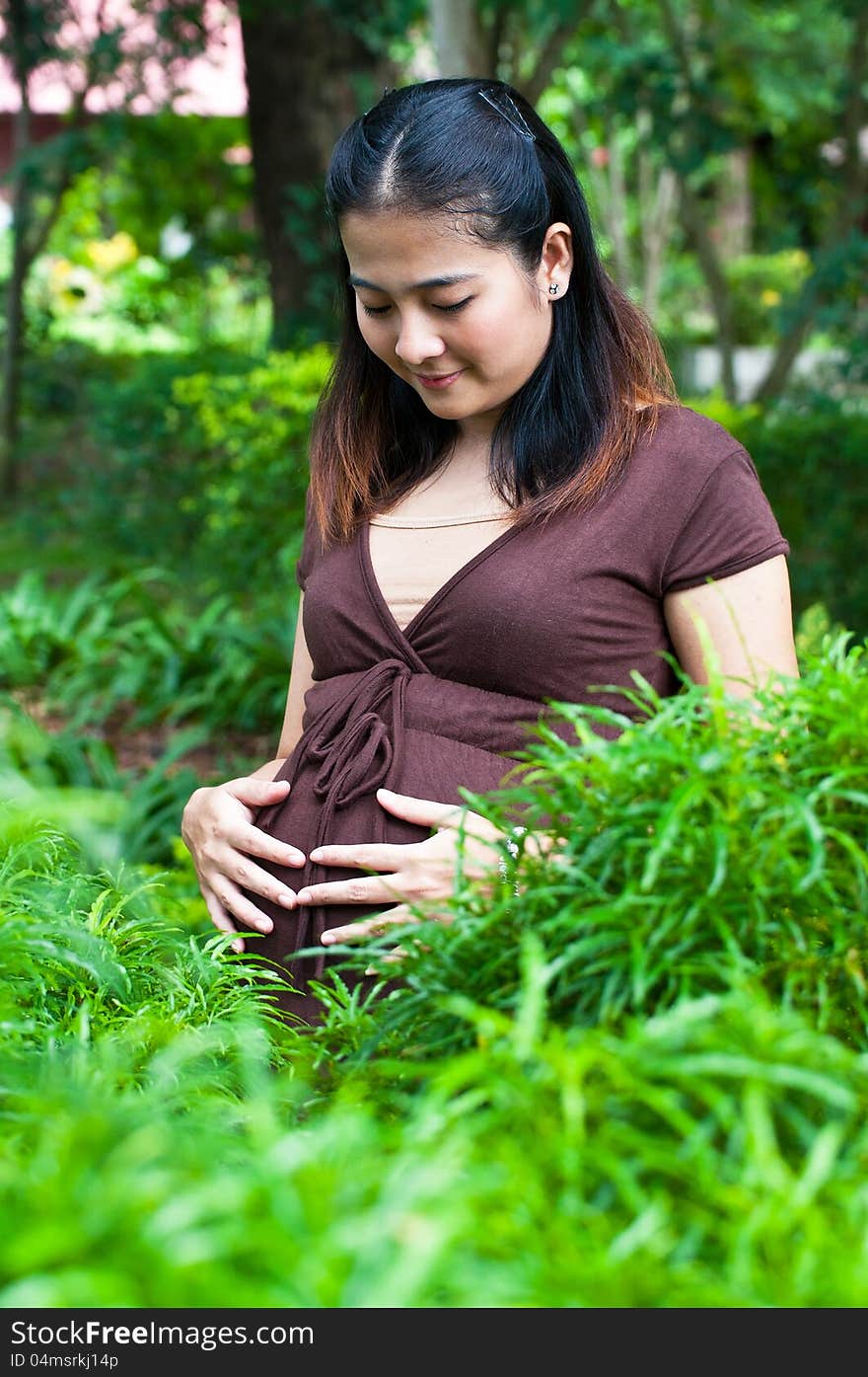 A beautiful pregnant mother to be in gardens