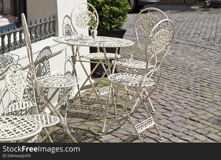 Old town outdoor cafe with vintage chairs. Old town outdoor cafe with vintage chairs