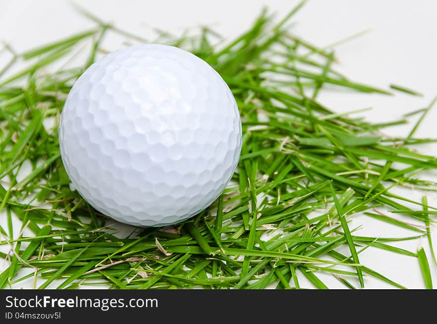 White golf ball on fresh grass