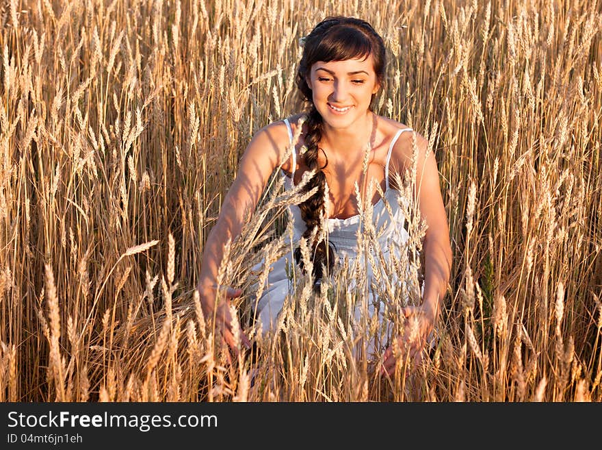 Woman in white dress in field