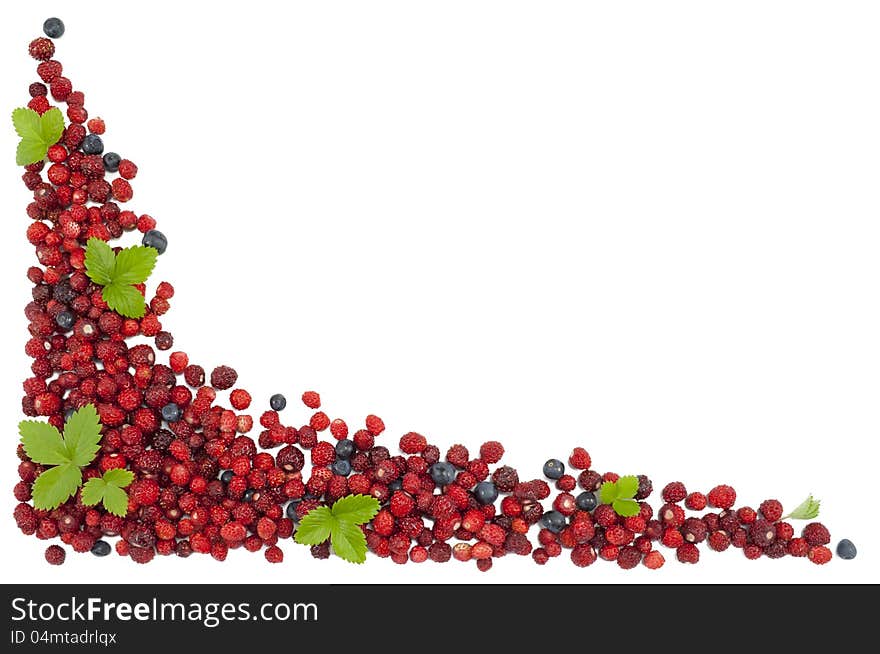 Delicious wild strawberries and blueberries with green leaves isolated on white background