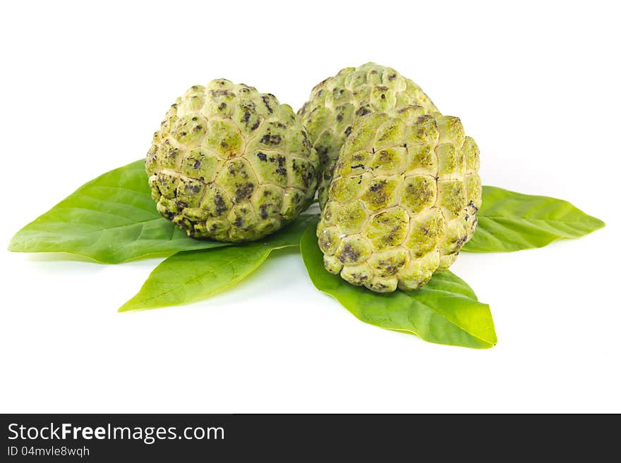 Custard apple  and leaves on white background