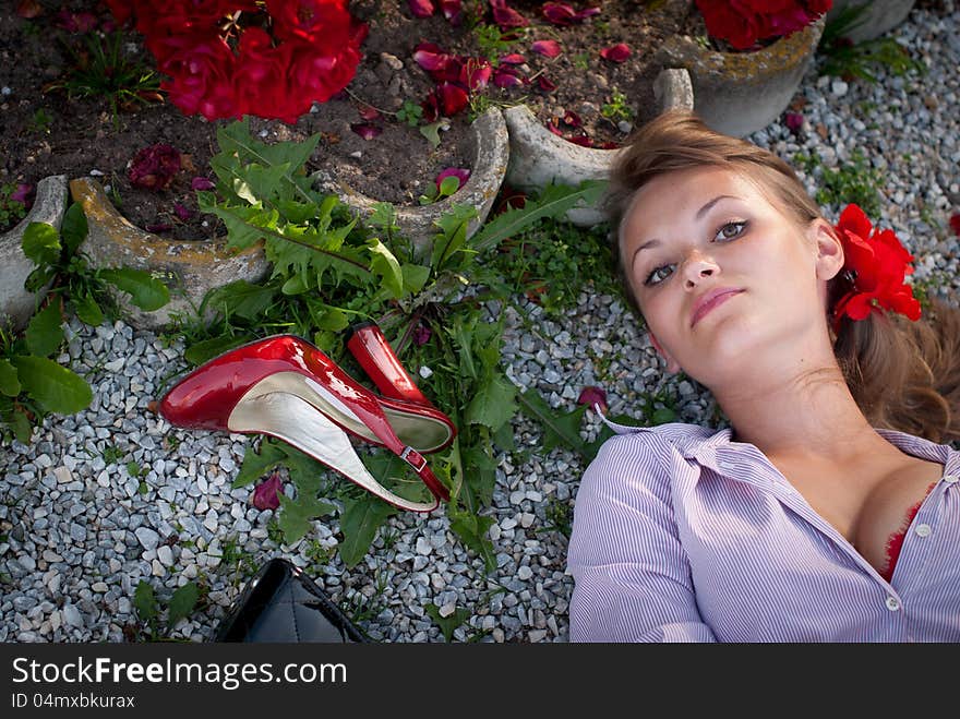 Beautiful young woman lying on the ground. Beautiful young woman lying on the ground