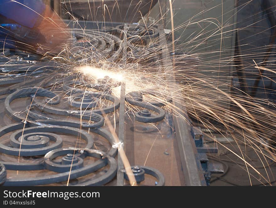 Worker welding metal. Production and construction